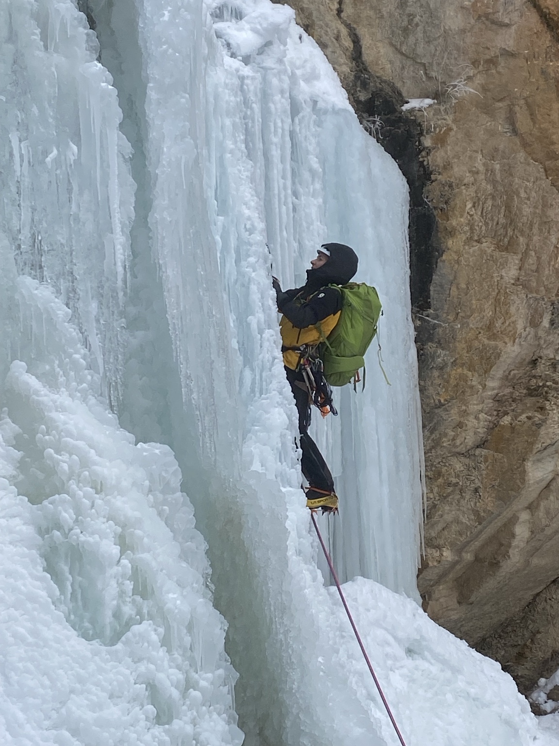 A climber on the frozen waterfall at Ladies’ First Falls